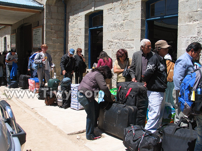 Line for boarding among local shuttle traders