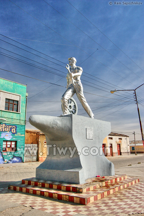 Sculptural compositions of a worker with a wrench