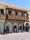 Red tiled roofs and jolly carved balconies