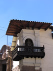 Red tiled roofs and jolly carved balconies